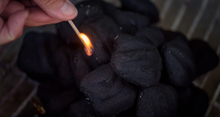 Instant lighting charcoal briquettes